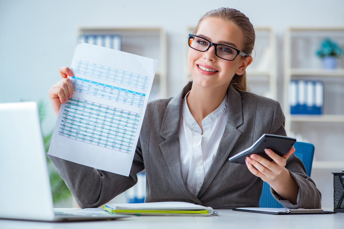 Woman Holding a Document and Calculator 